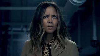 Halle Berry's Jo looking worried while inside a room filled with pipes in Moonfall